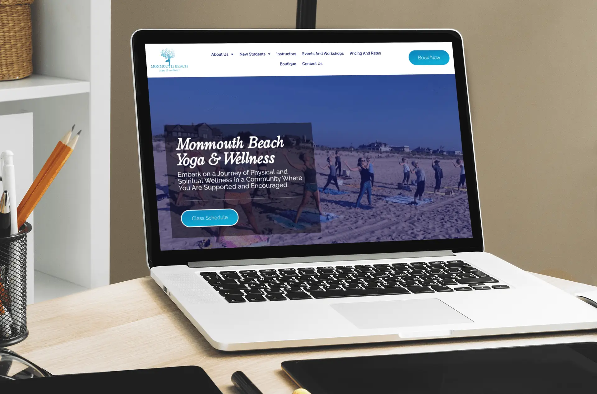 Monmouth Beach Yoga and Wellness website displayed on a laptop