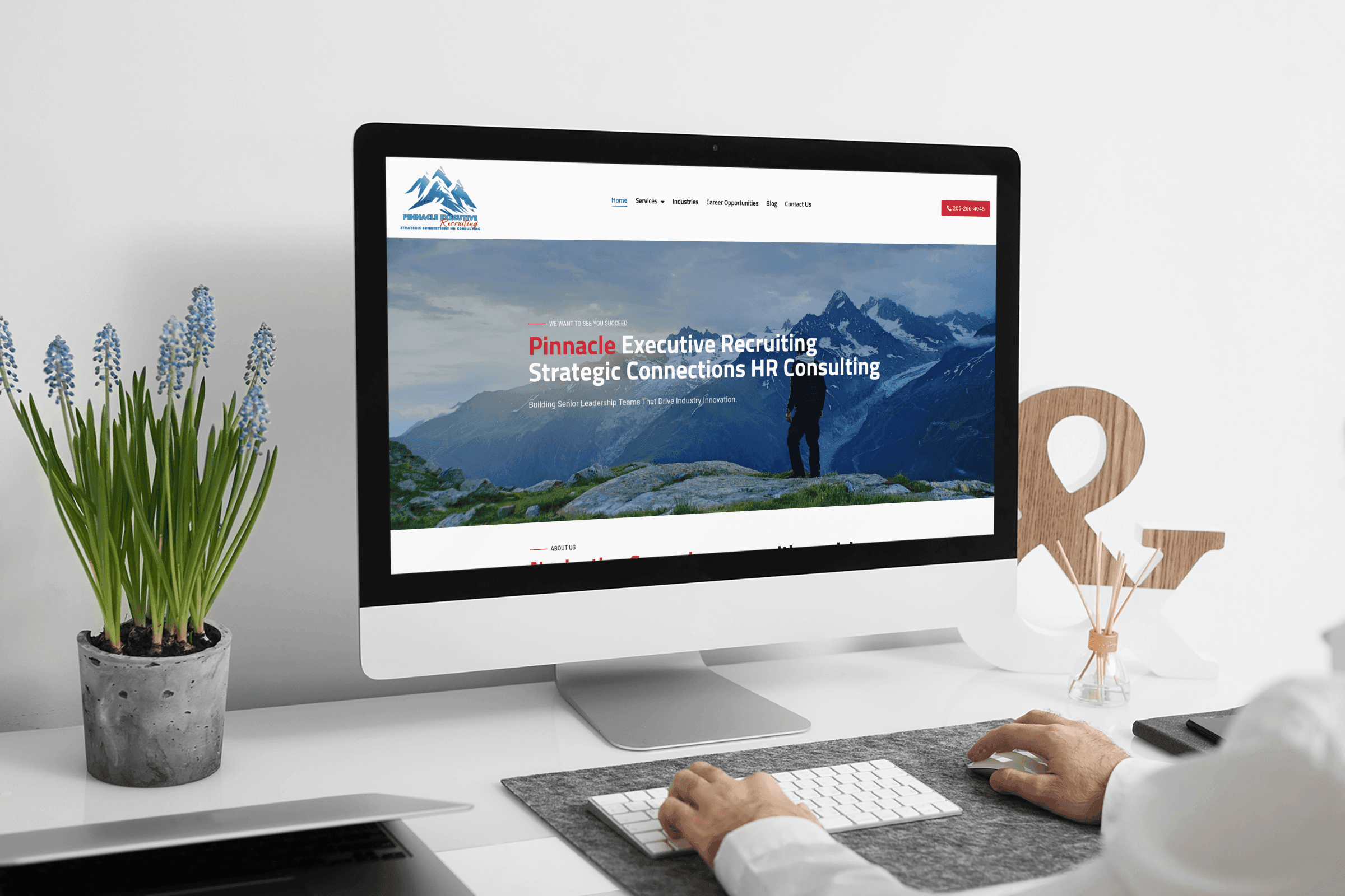 Pinnacle Executive Recruiting website displayed on a desktop monitor